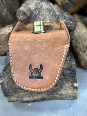 Leather pouch on wooden surface